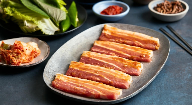 Sliced Tyson Fresh Meats pork belly in a Korean marinade