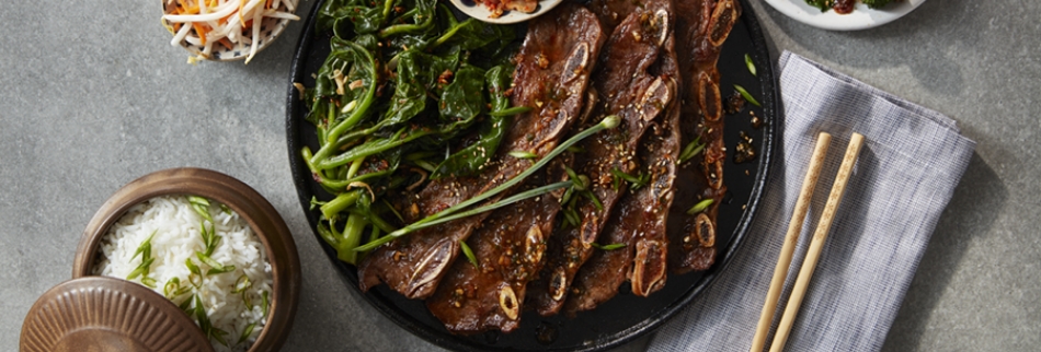 Tyson Fresh Meats Korean flanken-style short ribs served with greens
